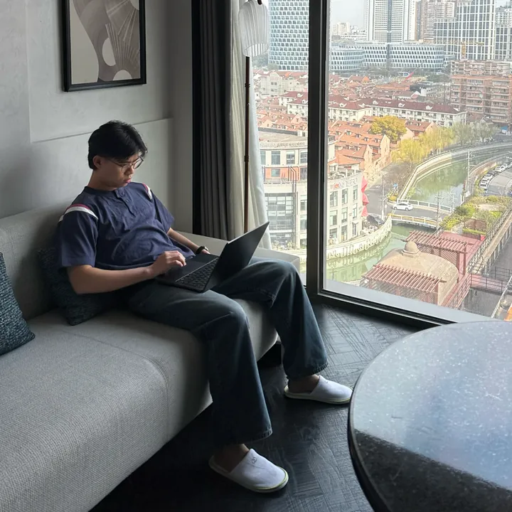 Jun, founder of QwickStep AI, working on a laptop